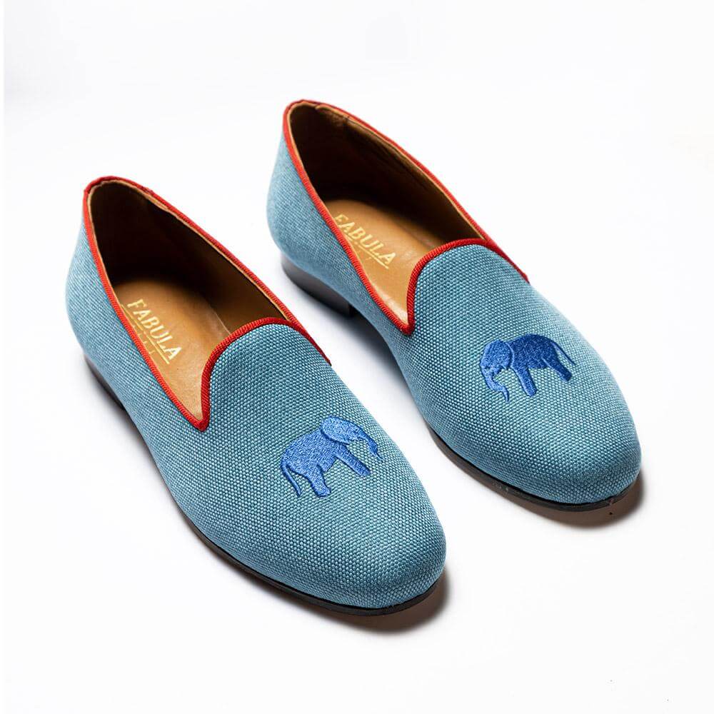 Blue linen slippers with red grosgrain trimming, blue elephant embroidery on top and nubuck leather sole.