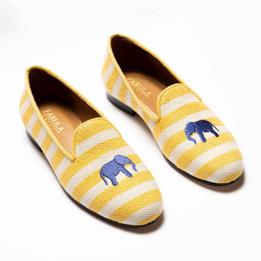 Luxury yellow and beige striped linen slippers with yellow grosgrain trimming, blue elephant embroidery on top and nubuck leather sole.