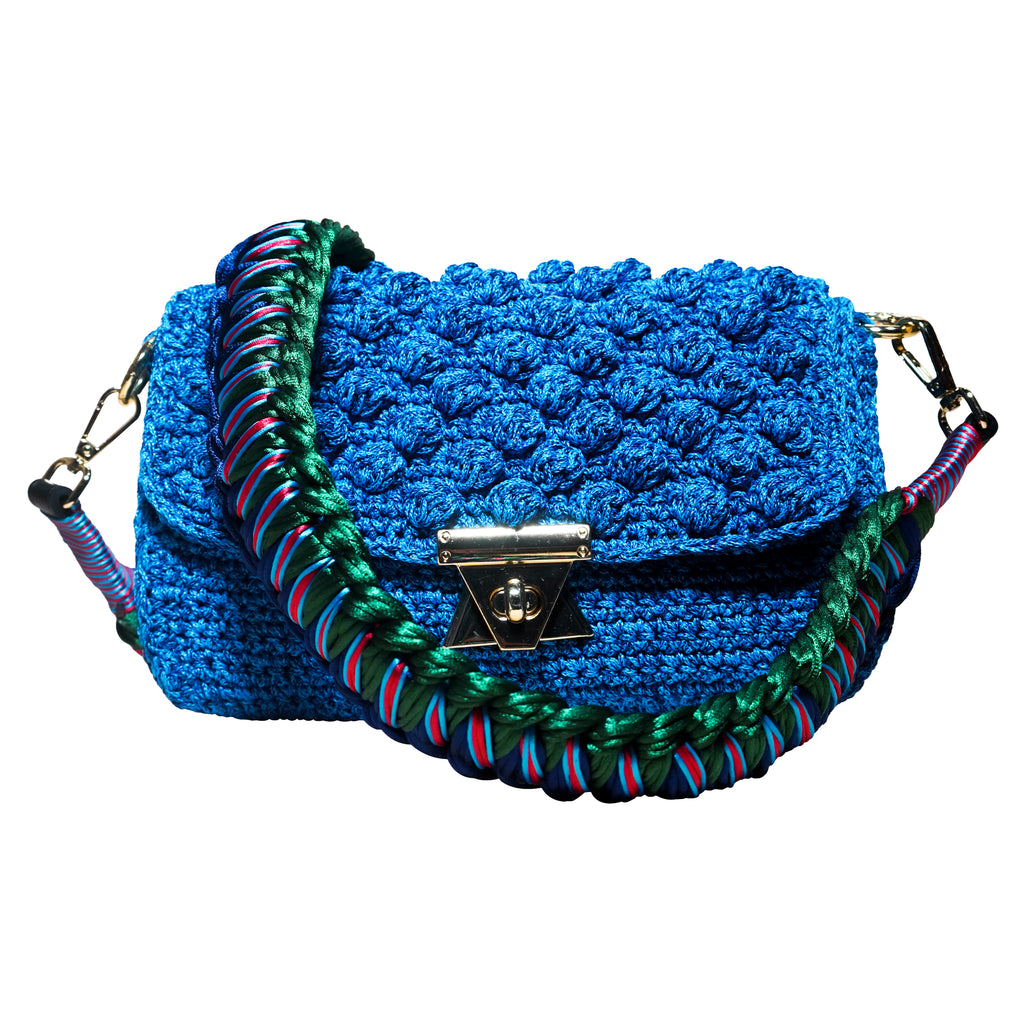 turquoise handmade crochet bag with a green knitted shoulder strap