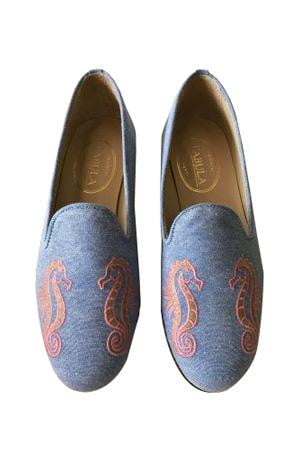 handmade blue linen slippers with an orange seahorse embroidery