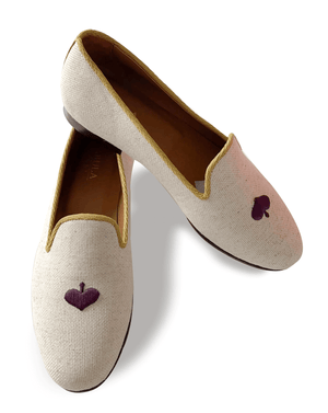 Beige linen slippers with yellow grosgrain trimming, black queen of spades embroidery on top and nubuck leather sole.